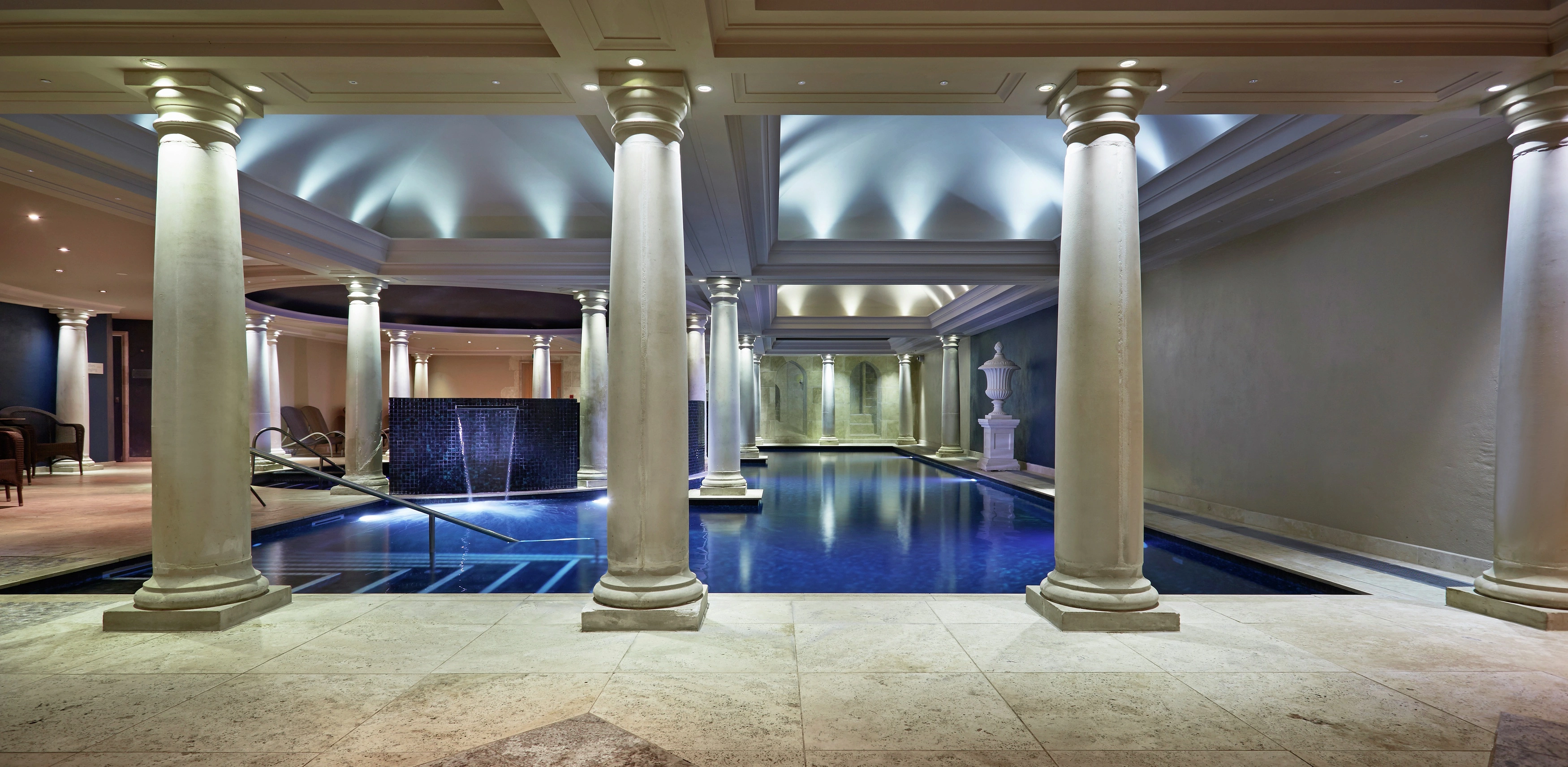 Chilstone handmade columns around an indoor swimming pool.