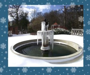 A large Chilstone fountain frozen with large icicles trailing from the rim.